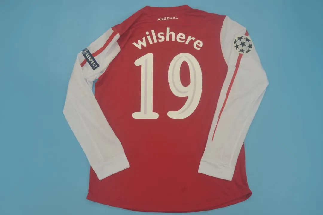 11-12 Arsenal home UCL fonts 8