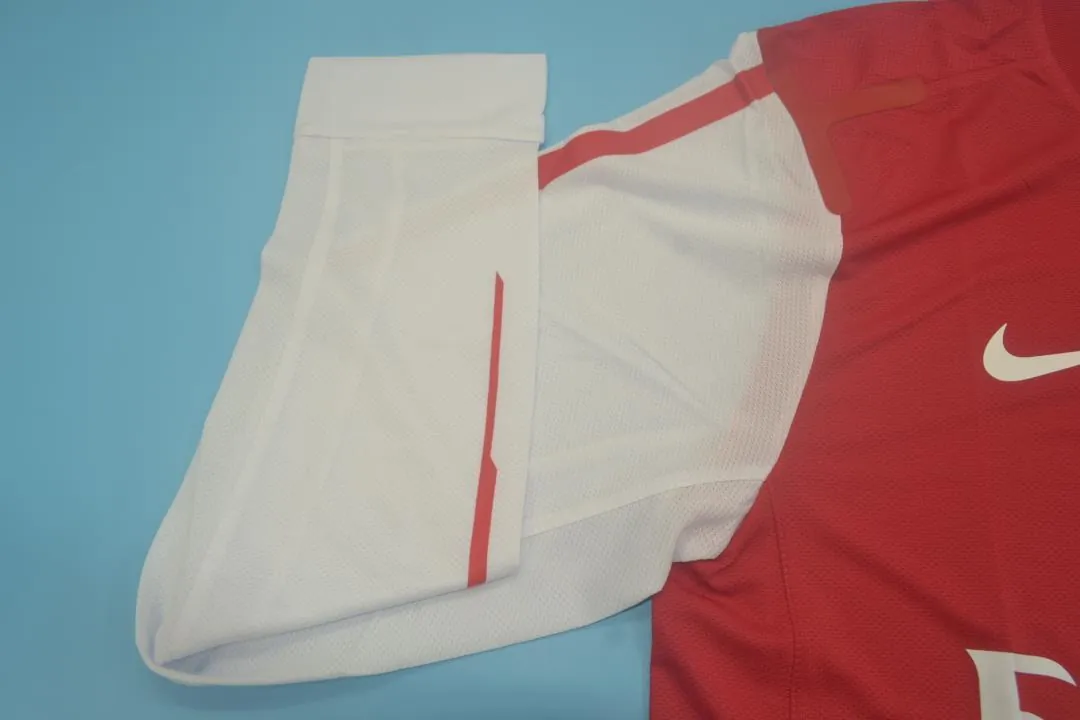 11-12 Arsenal home UCL fonts 9