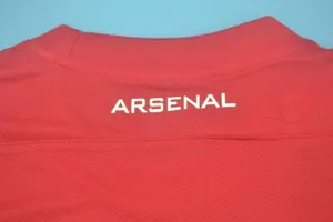 11-12 Arsenal home UCL fonts 7