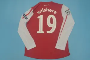 11-12 Arsenal home UCL fonts 8